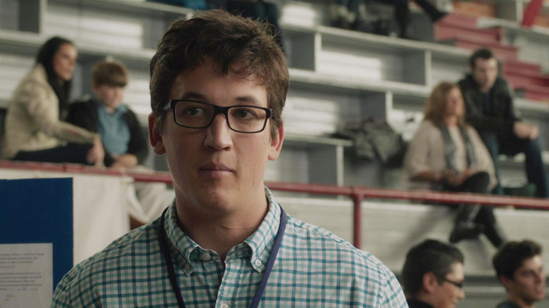 Miles Teller as Reed Richards wearing glasses in Fantastic Four (2015)