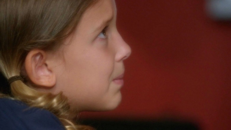 Millie Bobby Brown-Bongiovi's Rachel Barnes, seen in profile, looks anxious in NCIS