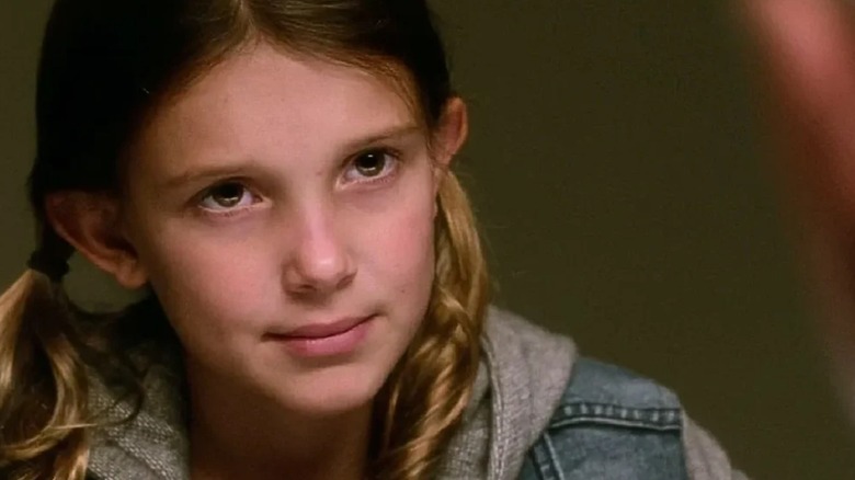 Millie Bobby Brown-Bongiovi's Rachel Barnes looks intensely across the interview table in NCIS
