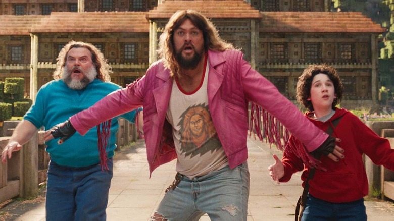 Jason Momoa as Garrett Garrison, Jack Black as Steve and Sebastian Hansen as Henry behold something awesome in A Minecraft Movie