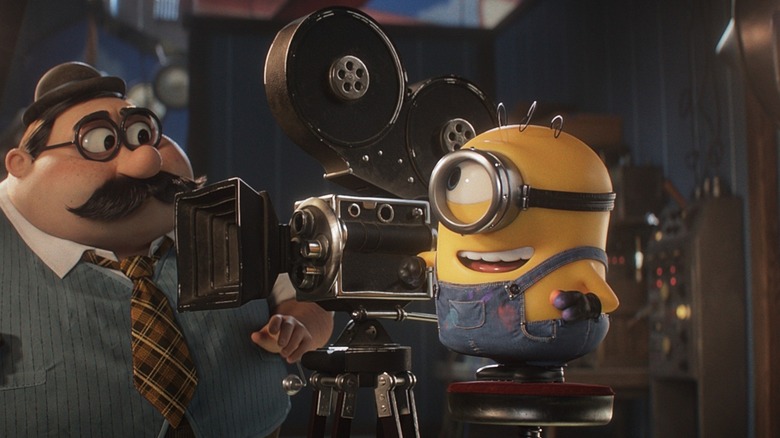 James giving instructions to a camera man on a movie set in Minions & Monsters
