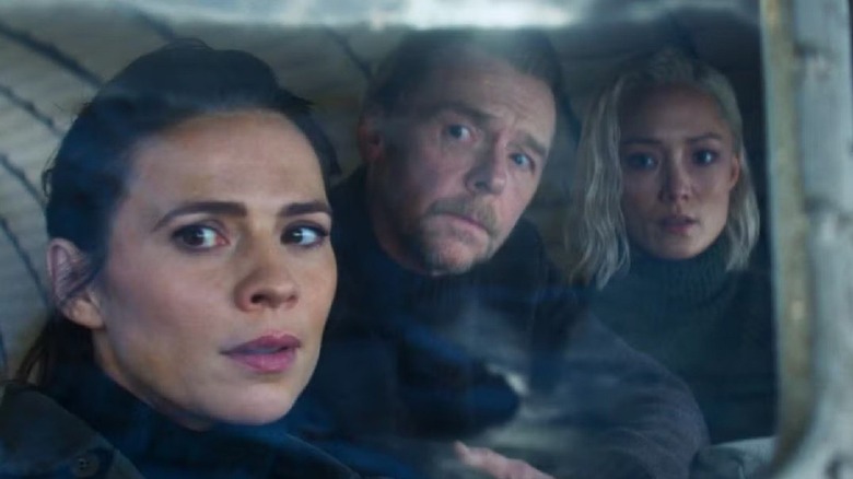 Grace (Hayley Atwell), Benji (Simon Pegg), and Paris (Pom Klementieff) look out from a car window