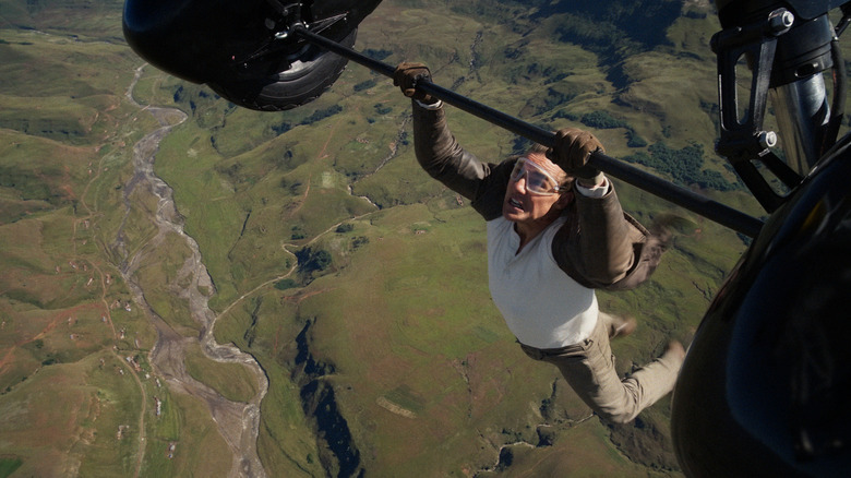 Ethan Hunt hangs from a plane in Mission: Impossible – The Final Reckoning