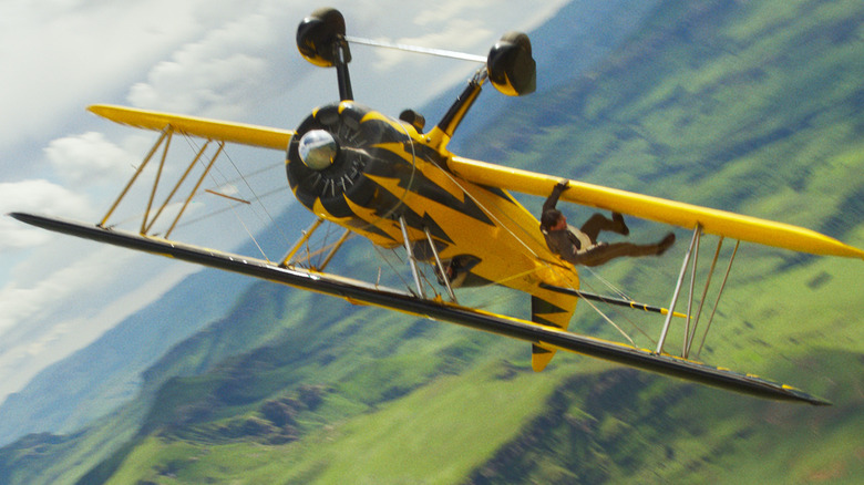 Ethan Hunt hangs from an upside down biplane in Mission: Impossible – The Final Reckoning
