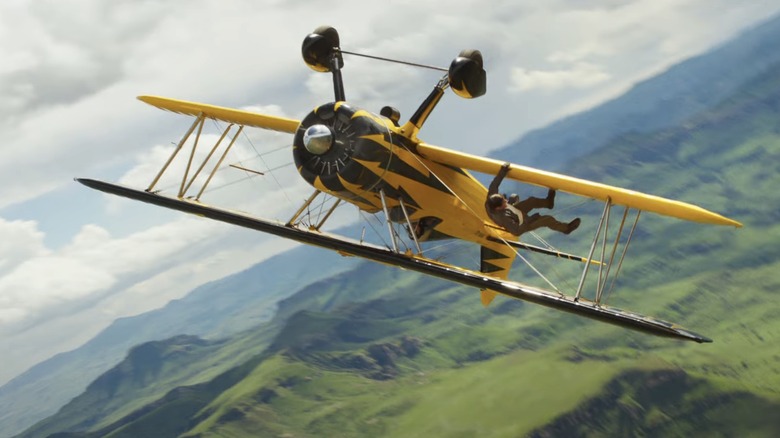 Ethan Hunt hangs off a plane in Mission: Impossible – The Final Reckoning
