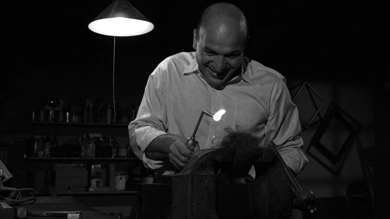 Telly Savalas as Erich Streator