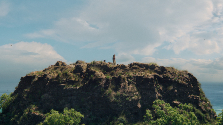 Moana out standing on a mountain in Moana