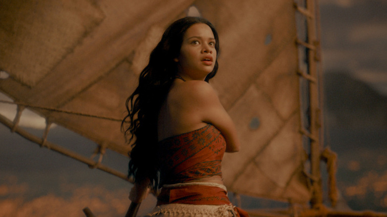 Moana facing something astonishing on her boat in Moana