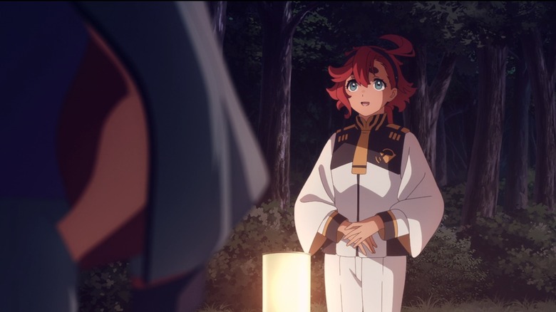 gundam witch from mercury suletta stands next to electric light