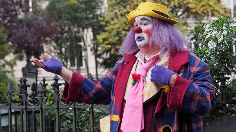 Eric Stonestreet as Cam, dressed as Fizbo the clown on Modern Family