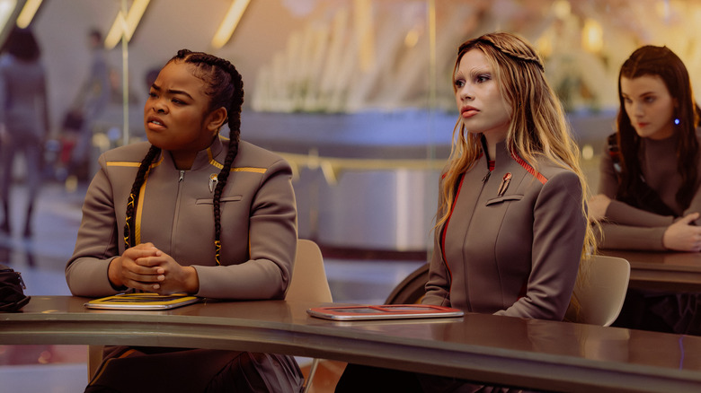 Sam and Genesis sittng at a desk on Star Trek: Starfleet Academy