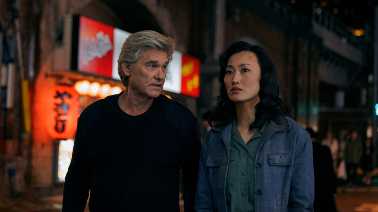 Kurt Russell as Lee and Mari Yamamoto as Keiko walking in a city together in Monarch: Legacy of Monsters