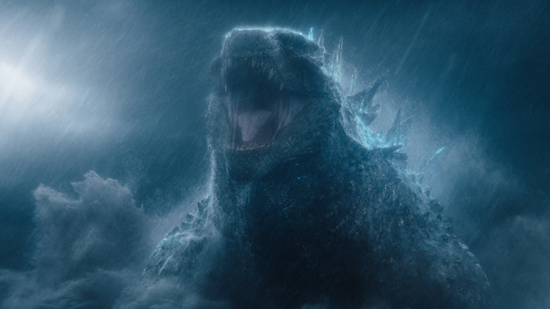 Godzilla emerging from the water in the rain in Monarch: Legacy of Monsters Season 2