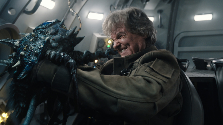 Kurt Russell as Lee Shaw fighting off a creature inside a cramped room in Monarch: Legacy of Monsters season 2
