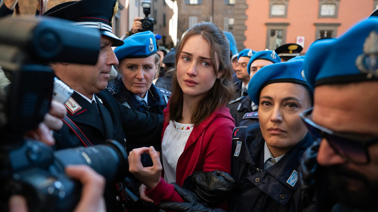 Amanda surrounded by police in The Twisted Tale of Amanda Knox