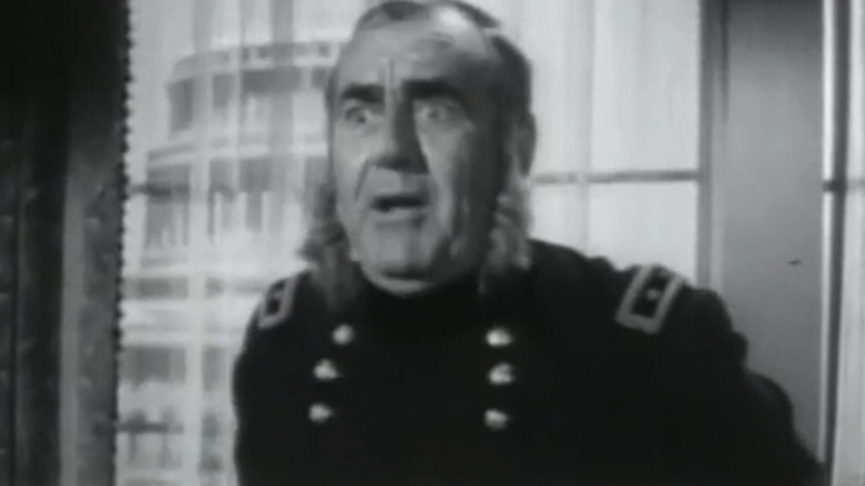 Jim Backus' General Willoughby looks shocked in his office in Advance to the Rear