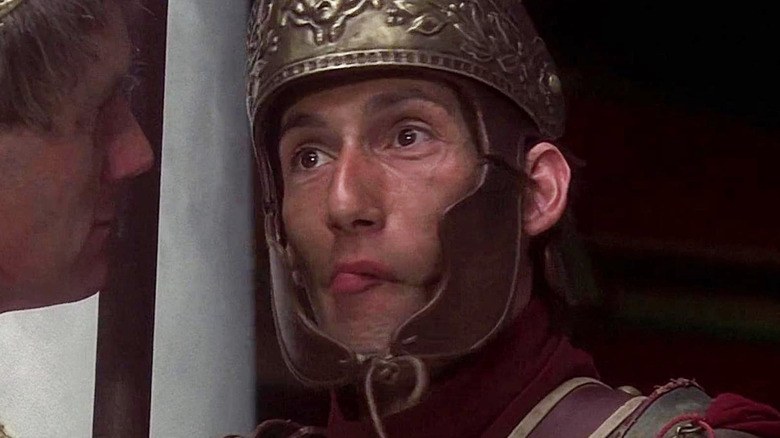 A Roman guard struggling not to laugh in Life of Brian