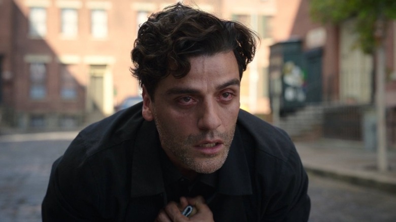 Marc Spector mourning in Moon Knight