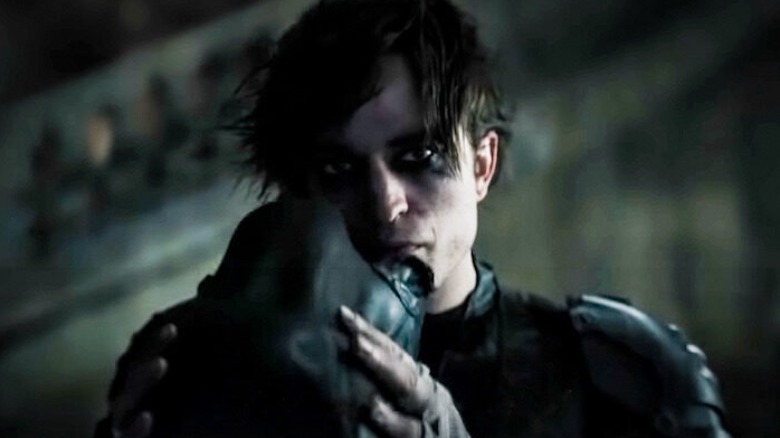 Bruce Wayne taking off mask