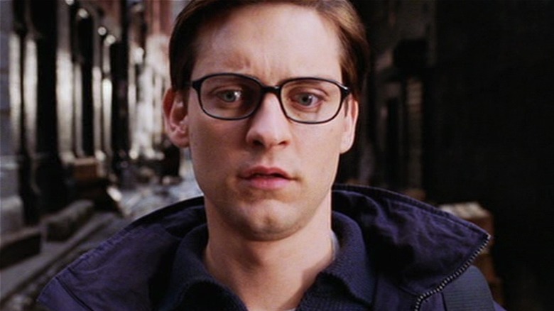 Tobey Macguire as Spider-Man trying to stop a train in Spider-Man 2 (2004)