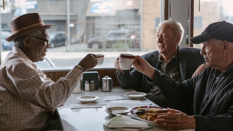 Morgan Freeman as Willie Davis, Michael Caine as Joe Harding, and Alan Arkin as Albert Garner eating at a diner in Going in Style