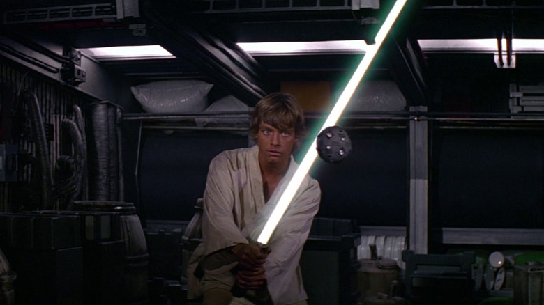 Luke Skywalker (Mark Hamill) training with a lightsaber in Star Wars