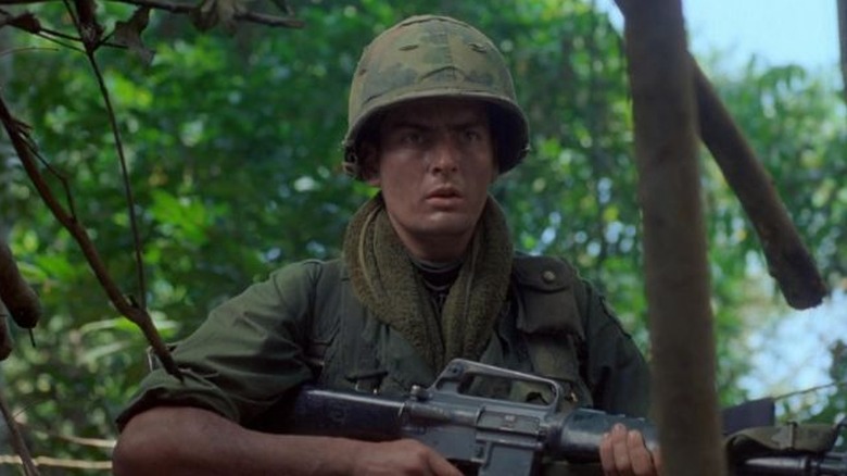 Charlie Sheen as Chris Taylor looks exhausted in Platoon