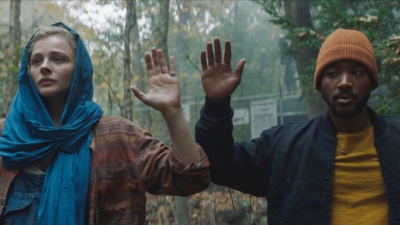 Georgia and Sam with their hands up