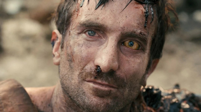 Sharlto Copley as Wikus van de Merwe transforms into a Prawn in District 9