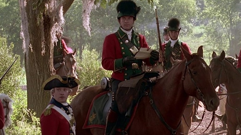 William Tavington (Jason Isaacs) reads a sealed letter with his troops in The Patriot