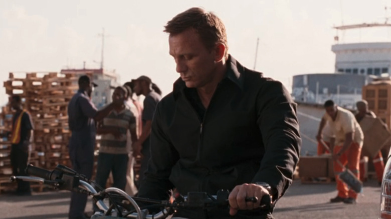 A street sweeper brushes above the ground behind James Bond (Daniel Craig) in Quantum of Solace
