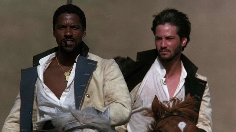 Denzel Washington and Keanu reeves riding horses in Much Ado About Nothing