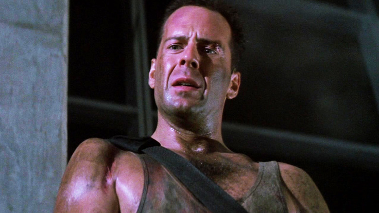Bruce Willis' John McClane is seen from a low angle in Die Hard
