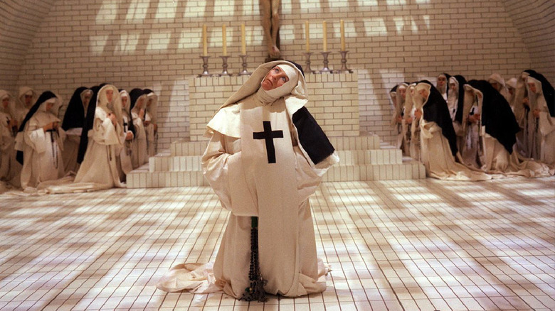 Nuns kneel around Mother Superior