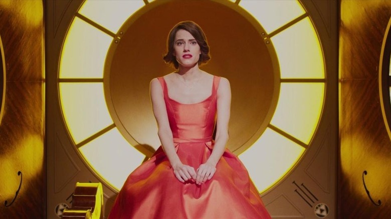 Allison Williams sits in ring of light