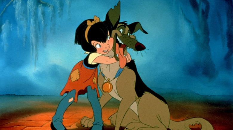 Anna-Marie (Judith Barsi) hugging Charlie (Burt Reynolds) in All Dogs Go to Heaven