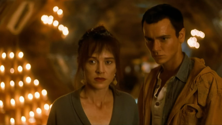 Buffy (Judy Davis) and Boy (River Phoenix) in bunker in Dark Blood