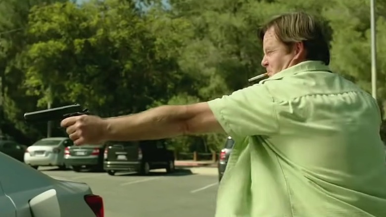Frank points a gun God Bless America