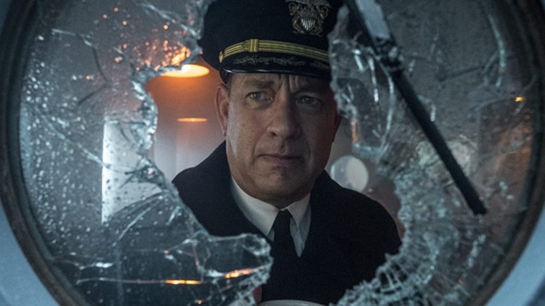 Tom Hanks stares out window