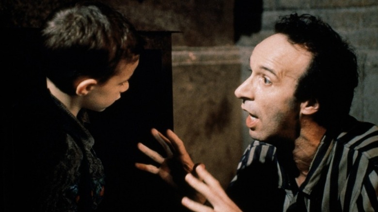 Roberto Benigni tell story to son