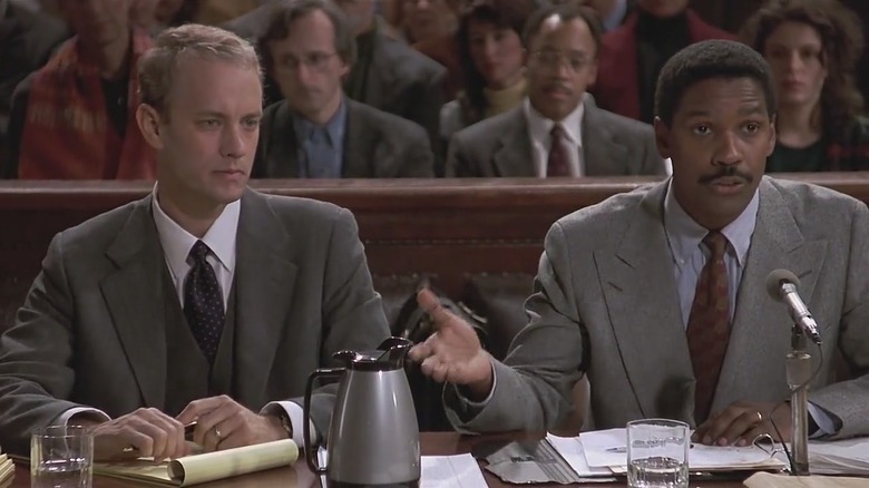 Tom Hanks sits with Denzel Washington