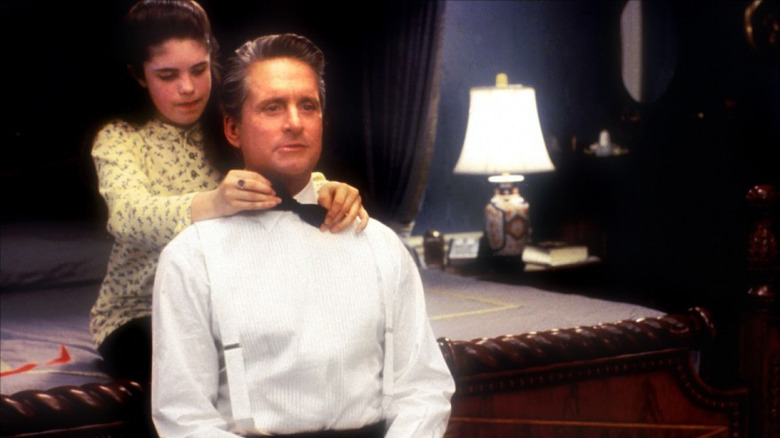 Michael Douglas sits in tux