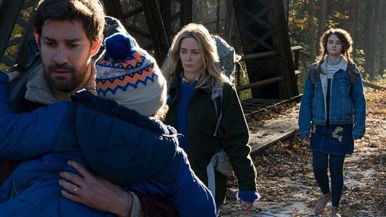 a quiet place Krasinski and Blunt protect their children