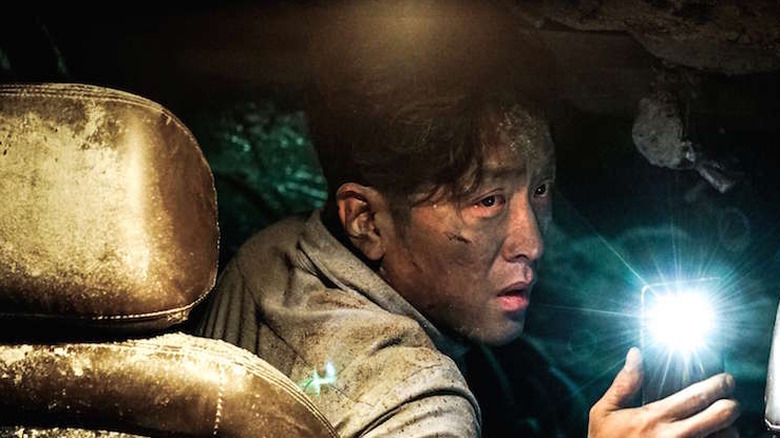 tunnel man uses cellphone as flashlight