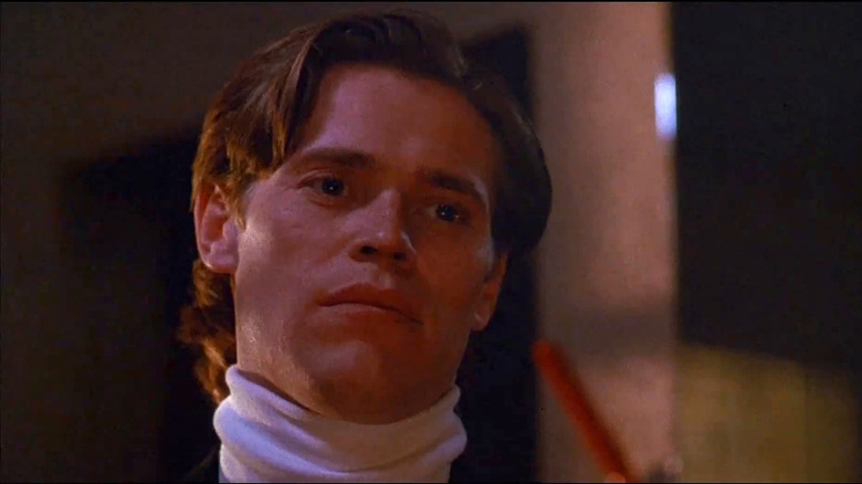 Rick Masters in a white turtleneck