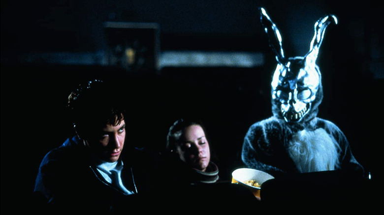 Donnie, Gretchen and Frank sitting in a movie theater