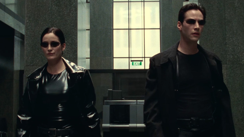 Trinity and Neo in a lobby