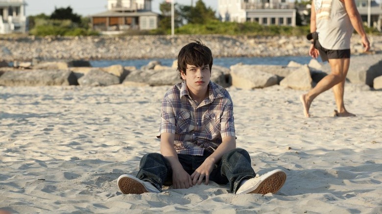 Liam James on beach