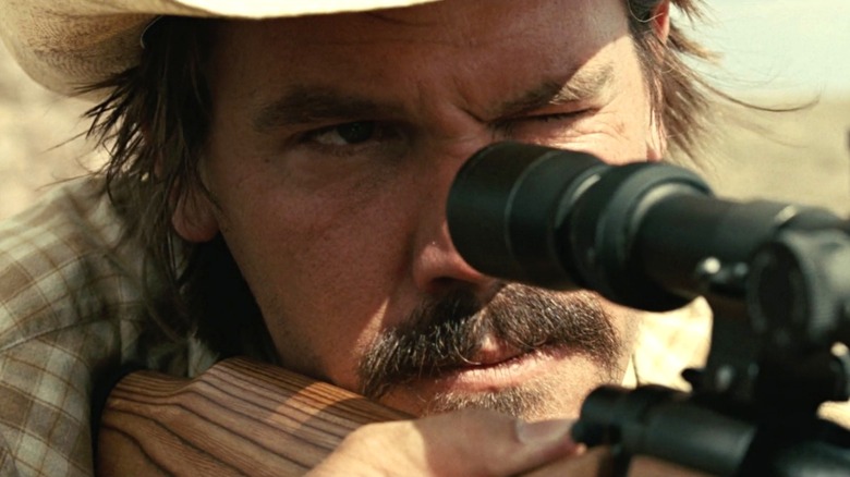 Josh Brolin points gun