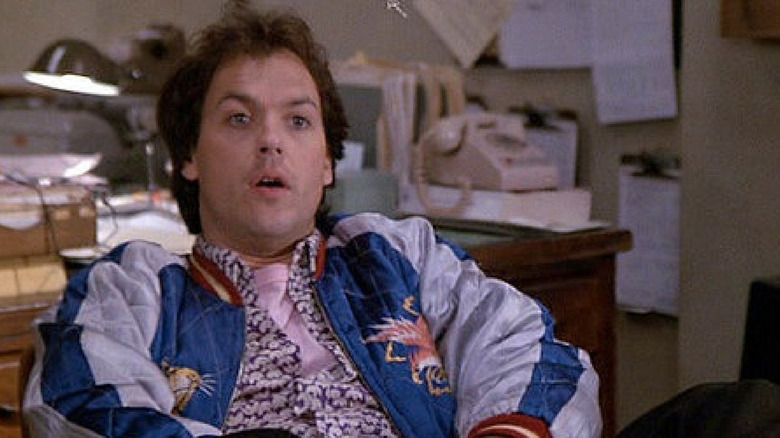 Michael Keaton leaning back